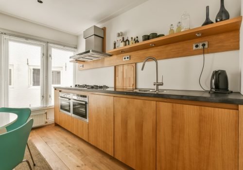 a kitchen with wooden cabinets and a sink