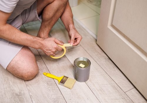 Preparation of tools for painting work. Repair staining the doors with paint.
